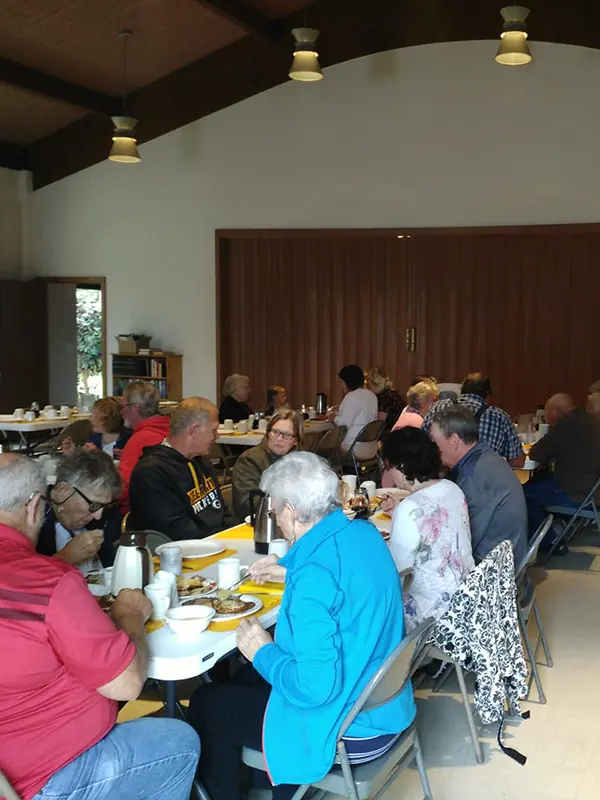 Church members sitting at a table