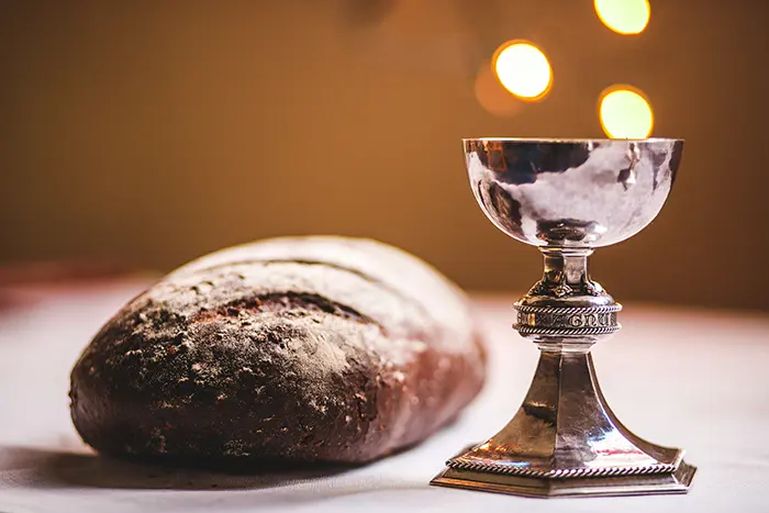 Bread and silver wine goblet